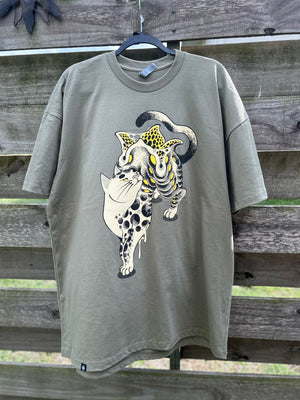 Gray t-shirt with a graphic design of a leopard on a wooden background