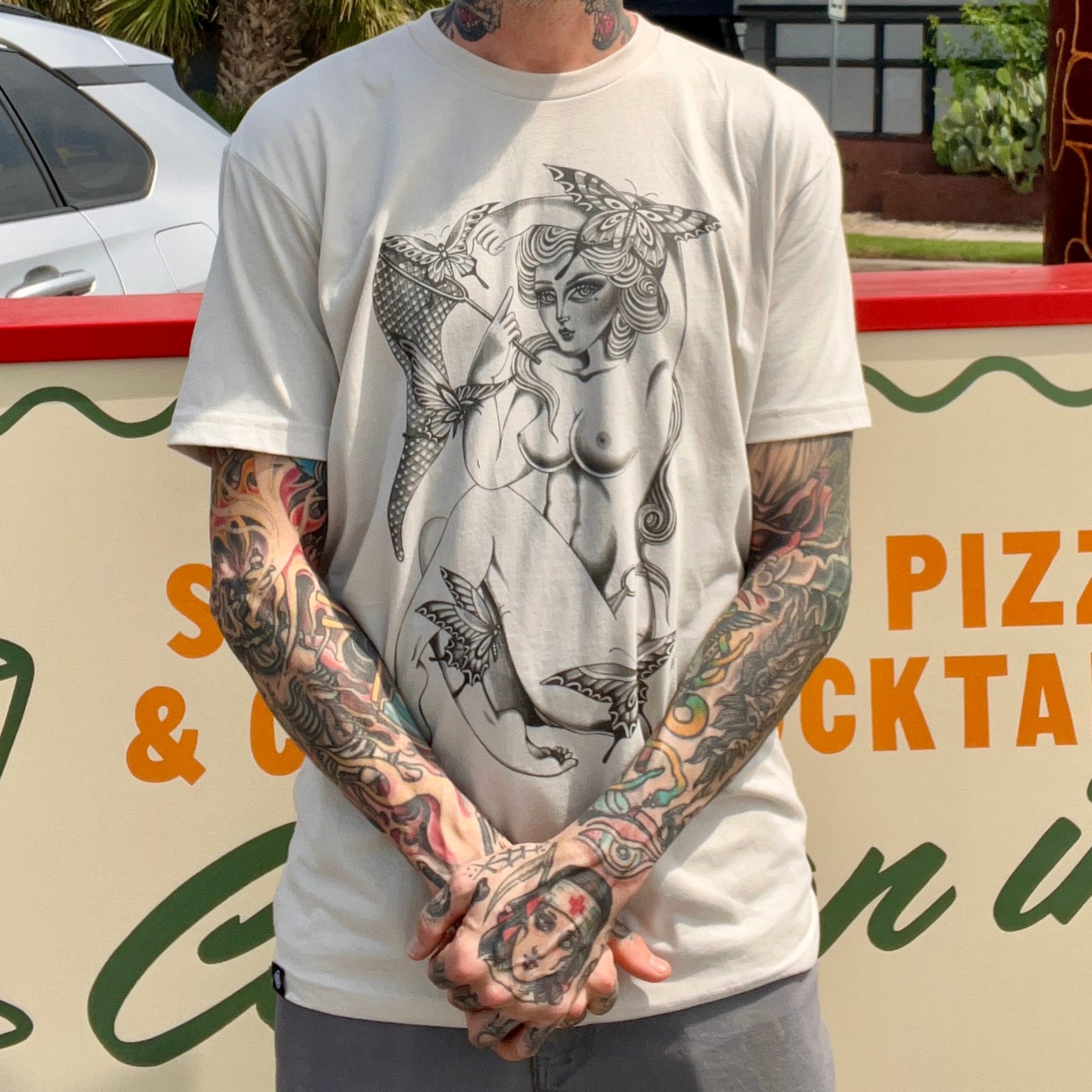 Close-up of Kyley O'Rourke The Collector tee showing detailed skull and floral artwork.