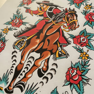 Traditional tattoo design of a cowboy on a horse with floral elements.