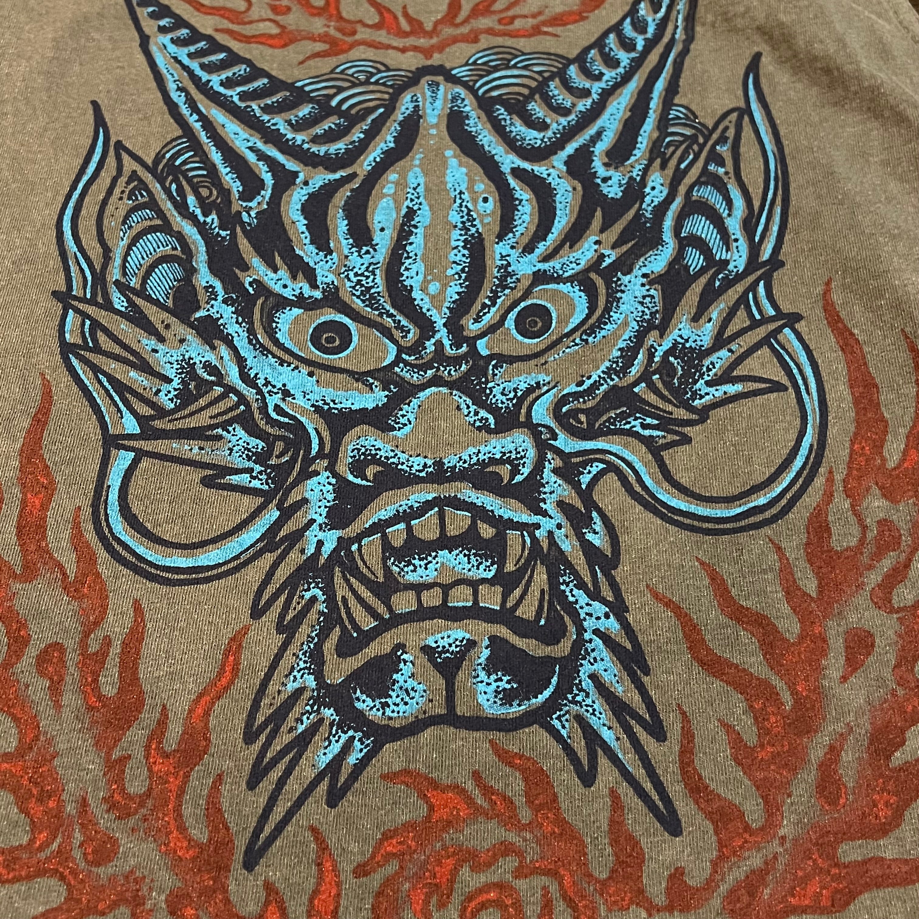 Dragon head design with flames on a textured background