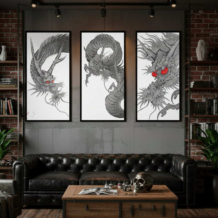 Three dragon artworks on a wall above a leather sofa in a room with brick walls and a wooden coffee table.