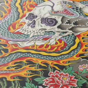 Colorful tattoo design featuring a skull, flames, and floral elements.