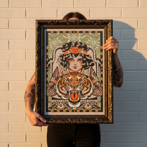 “Tigress print by Aaron Hindson framed and hung on wall.”