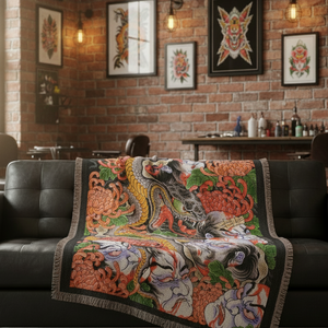 The Snake & The Namakubi blanket draped over a couch for stylish home decor.