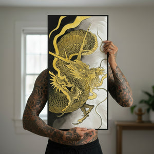 Person holding a framed artwork of a gold dragon on a black background